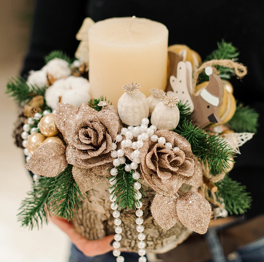 an image of a bouquet of flowers with a candle.