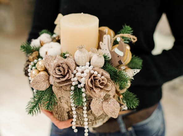 an image of a bouquet of flowers with a candle.